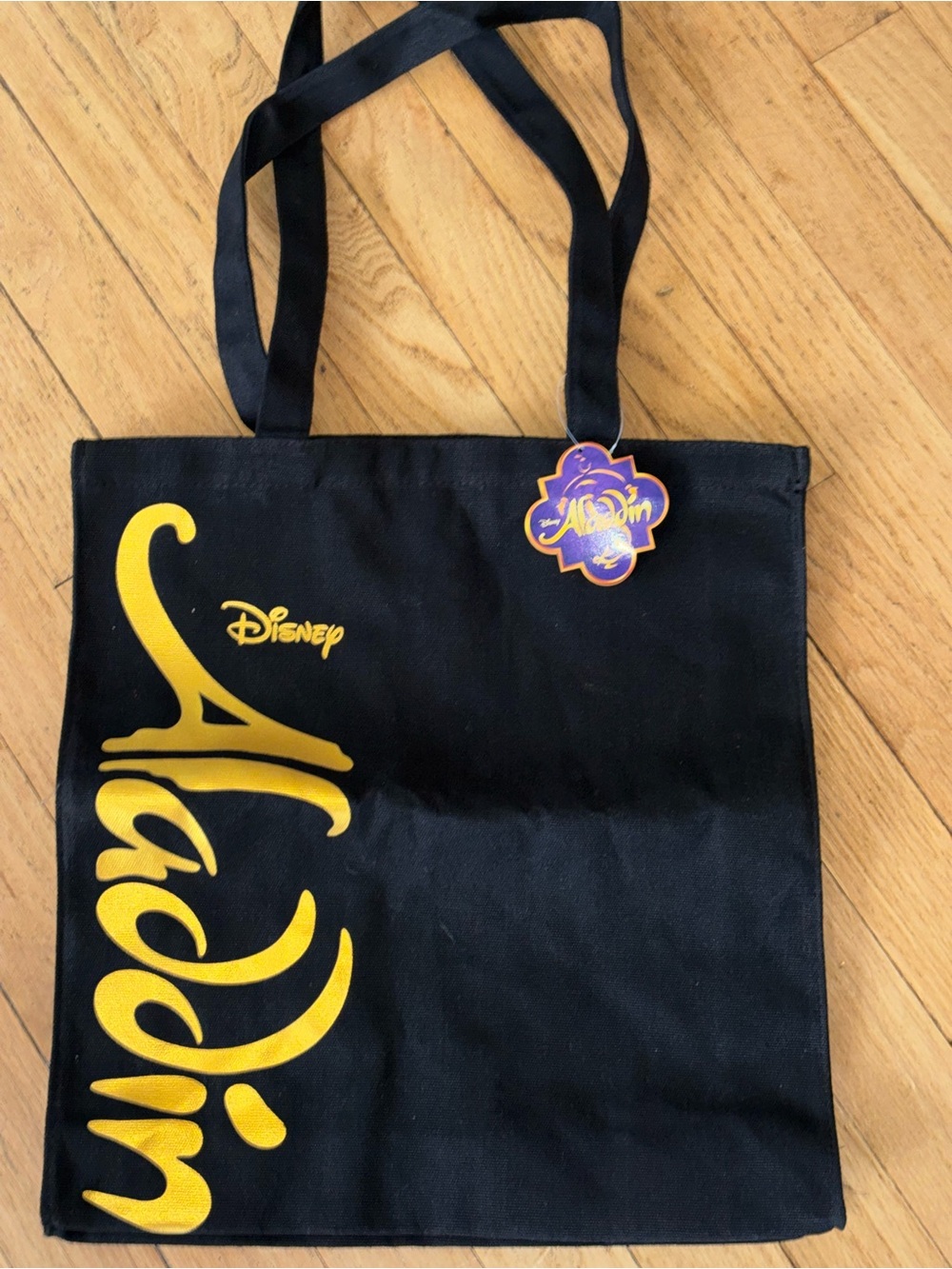 Disney Black Tote with Gold Aladdin Script and Purple Tag